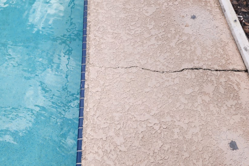 Cracked Pool Deck in Tampa Bay Florida That Needs Concrete Repair Services