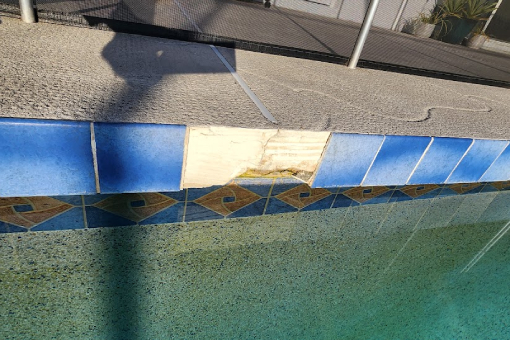 Broken Tiles in a Tampa Bay FL Resort Before Pool Deck Repair
