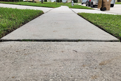 Sidewalk in Tampa Bay Before HOA Hired Sidewalk Repair Company
